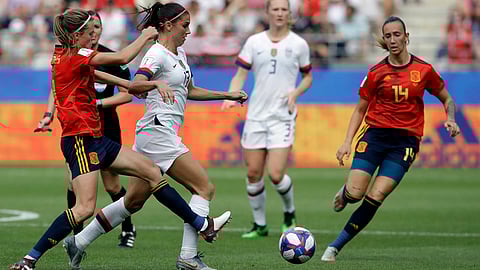 United States’Alex Morgan (13) is challenged by Spain’s Irene Paredes (left) and Virginia Torrecilla on June 24 (Alessandra Tarantino)