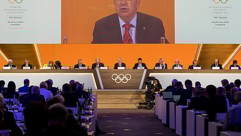 International Olympic Committee, IOC, President Thomas Bach from Germany speaks during the 134th Session of the International Olympic Committee (IOC), at the SwissTech Convention Centre, in Lausanne, Switzerland, Tuesday, June 25, 2019. (Jean-Christophe Bott/Keystone via AP)