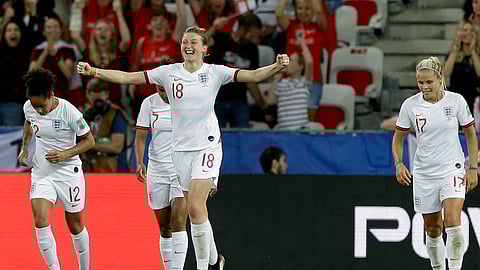 England’s Ellen White, front, celebrates after scoring her side’s second goal during the Women’s World Cup Group D soccer match between Japan and England at the Stade de Nice in Nice, France, Wednesday, June 19, 2019. (AP Photo/Claude Paris)