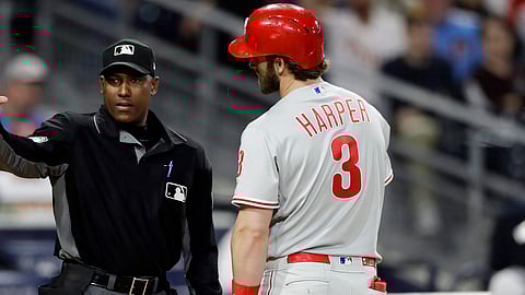 Phillies’ Bryce Harper discusses his eighth-inning strikeout with umpire Ramon De Jesus on June 3 (Gregory Bull)
