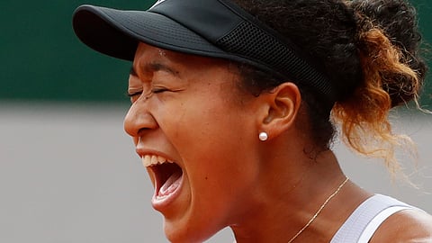 Japan’s Naomi Osaka screams after scoring a point against Victoria Azarenka of Belarus during their second round match of the French Open tennis tournament at the Roland Garros stadium in Paris, Thursday, May 30, 2019. (AP Photo/Jean-Francois Badias)