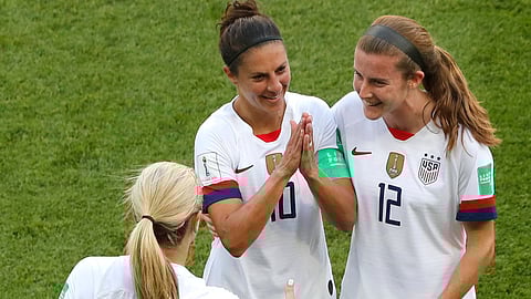 Carli Lloyd (10) celebrates with Lindsey Horan (9) and Tierna Davidson after scoring the opening goal on June 16 (Thibault Camus)