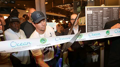 Movie star Mark Wahlberg cuts the ribbon to open the newest wahlburgers location, at Ocean Resort Casino.