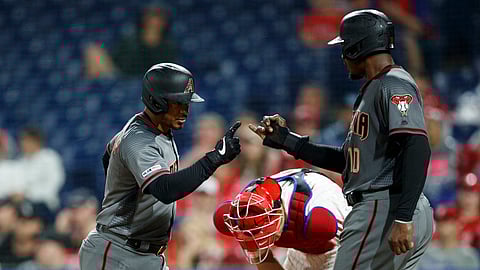 Diamondbacks’ Eduardo Escobar (left) and Adam Jones celebrate after Escobar’s two-run home run in the fourth inning on June 10 (Matt Slocum)