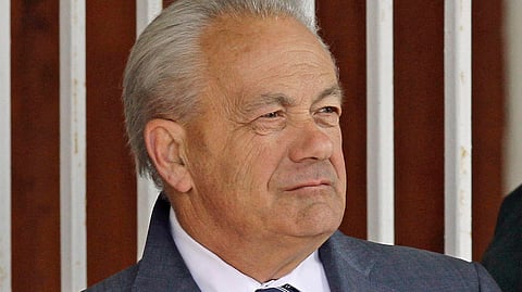 FILE - In this March 22, 2014, file photo, horse trainer Jerry Hollendorfer stands in the paddock at Turfway Park in Florence, Ky. Hollendorfer was banned by the ownership of Santa Anita on Saturday, June 22, 2019, after a fourth horse from his stable died--and the 30th overall--at the Southern California track. (AP Photo/Garry Jones, File)