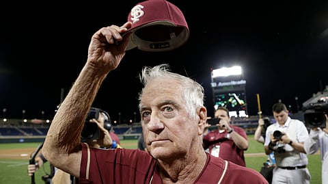 Retiring Florida State coach Mike Martin tips his hat to spectators following the team’s final NCAA College World Series game against Texas Tech on June 19 (Nati Harnik)