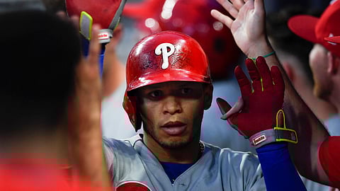 Cesar Hernandez is greeted in the dugout following his last home run, on June 15 in Atlanta (John Amis)