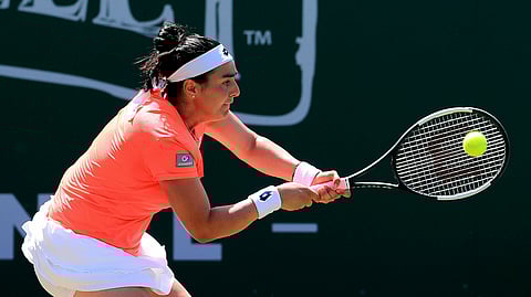 Ons Jabeur of Tunisia in action during the singles match against Alize Cornet of France during day five of the Eastbourne Open tennis tournament at Devonshire Park, Eastbourne, England, Thursday June 27, 2019. (Gareth Fuller/PA via AP)