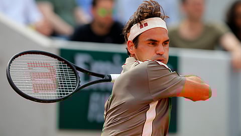 This Swiss don’t miss: Switzerland’s Roger Federer plays a shot against Switzerland’s Stan Wawrinka during their quarterfinal match of the French Open tennis tournament at the Roland Garros stadium in Paris, Tuesday, June 4, 2019. (AP Photo/Michel Euler)