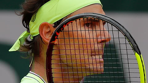 In this June 7, 2019, file photo, Spain’s Rafael Nadal grimaces after scoring against Switzerland’s Roger Federer during their semifinal match of the French Open tennis tournament at the Roland Garros stadium in Paris.