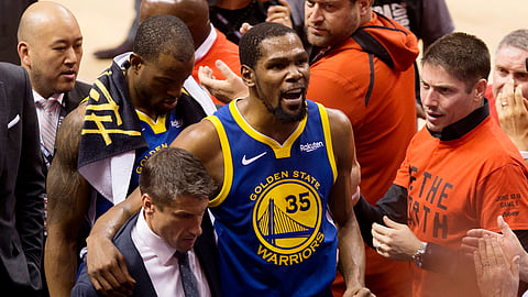 Golden State Warriors forward Kevin Durant (35) reacts as he leaves the court after sustaining an injury during first-half basketball action against the Toronto Raptors in Game 5 of the NBA Finals in Toronto, Monday, June 10, 2019. (Chris Young/The Canadian Press via AP)