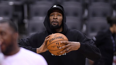 Golden State Warriors Kevin Durant watches during basketball practice at the NBA Finals in Toronto, Saturday, June 1, 2019. (Nathan Denette/The Canadian Press via AP)