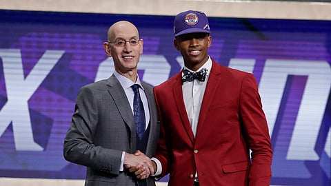 NBA Commissioner Adam Silver poses for photographs with Texas Tech’s Jarrett Culver after the Phoenix Suns selected him as the sixth pick overall in the NBA basketball draft Thursday, June 20, 2019, in New York. (AP Photo/Julio Cortez)