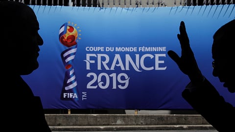 Two men talks in front of one of the entrance of the Parc des Princes stadium on June 6 (Alessandra Tarantino)