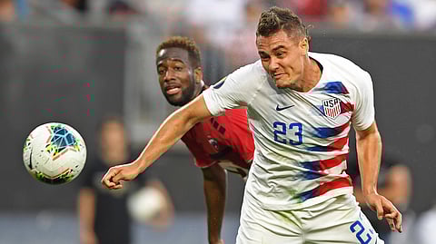U.S. defender Aaron Long heads the ball in for a goal during the first half of the team’s CONCACAF Gold Cup soccer match against Trinidad and Tobago, Saturday, June 22, 2019, in Cleveland.