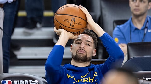 Warriors’ Klay Thompson practices his shot motion from the bench during practice on June 4 (Frank Gunn/The Canadian Press)
