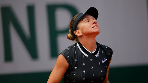 Simona Halep reacts after missing a shot against Amanda Anisimova during the French Open on June 6 (Michel Euler)