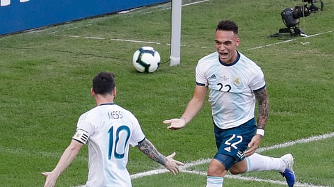 Argentina’s Lautaro Martinez, right, celebrates scoring his side’s opening goal with teammate Lionel Messi during a Copa America quarterfinal soccer match against Venezuela at the Maracana stadium in Rio de Janeiro, Brazil, Friday, June 28, 2019.