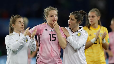 Scotland’s Jane Ross, right, comforts teammate Sophie Howard, center, at the end of the Women’s World Cup Group D soccer match between Scotland and Argentina at Parc des Princes in Paris, France, Wednesday, June 19, 2019. The match ended in a 3-3 draw. (AP Photo/Alessandra Tarantino)