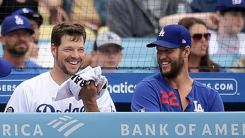 Dodgers starting pitcher Rich Hill (left) and Clayton Kershaw talk in the dugout during the seventh inning against the Phillies on June 2 (Mark J. Terrill)