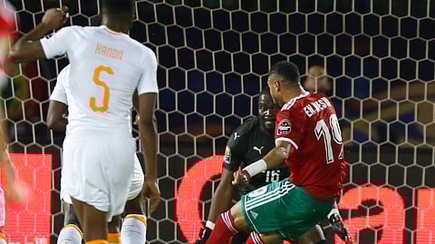 Morocco’s Youssef En-Nesyri scores during the African Cup of Nations group D soccer match between Morocco and Ivory Coast in Al Salam Stadium in Cairo, Egypt, Friday, June 28, 2019. (AP Photo/Ariel Schalit)