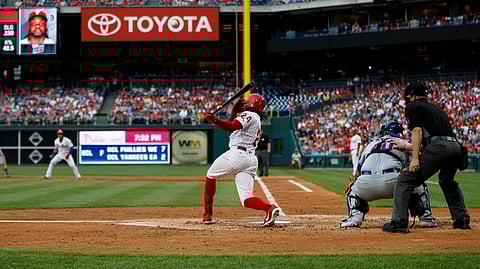 Phillies’ Roman Quinn hits a run-scoring single against the Mets on June 24 (Matt Slocum)