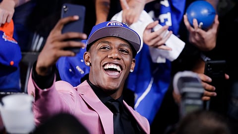 RJ Barrett poses for selfies with fans after he was selected by the New York Knicks at the NBA basketball draft Thursday, June 20, 2019, in New York. Barrett was selected third overall. (AP Photo/Julio Cortez)