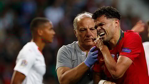 Portugal’s Pepe, right, grimaces in pain after a tackle by Switzerland’s Manuel Akanji during the UEFA Nations League semifinal soccer match between Portugal and Switzerland at the Dragao stadium in Porto, Portugal, Wednesday, June 5, 2019. (AP Photo/Armando Franca)