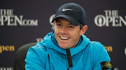 Northern Ireland's Rory McIlroy smiles as he listens to a question from the media at a press conference ahead of the start of the British Open golf championships at Royal Portrush in Northern Ireland, Wednesday, July 17, 2019. The British Open starts Thursday. (AP Photo/Matt Dunham)