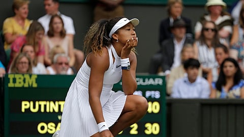 Japan’s Naomi Osaka reacts as she plays Kazakstan’s Yulia Putintseva in a Women’s singles match during day one of the Wimbledon Tennis Championships in London, Monday, July 1, 2019.