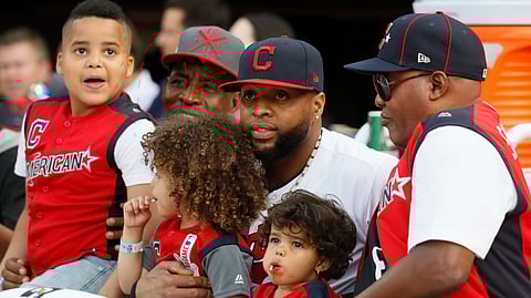Carlos Santana watches Monday’s Home Run Derby with his family (John Minchillo)