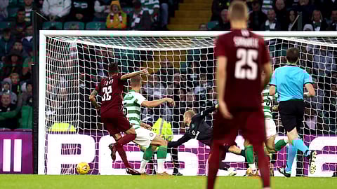 FK Sarajevo's Benjamin Tatar, left, scores against Celtic during the Champions League first qualifying round, second leg soccer match at Celtic Park, Glasgow, Scotland, on July 17, 2019.