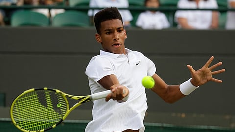 Canada’s Felix Auger-Aliassime returns to Ugo Humbert of France in a Men’s singles match during day five of the Wimbledon Tennis Championships in London, Friday, July 5, 2019.