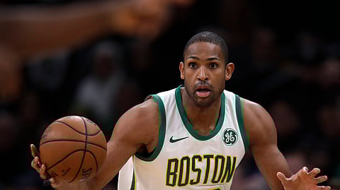 FILE - In this Jan. 16, 2019, file photo, Boston Celtics center Al Horford (42) looks to pass the ball during the first quarter of a basketball game against Toronto, in Boston. Horford is expected to sign with the Philadelphia 76ers. (AP Photo/Charles Krupa, File)