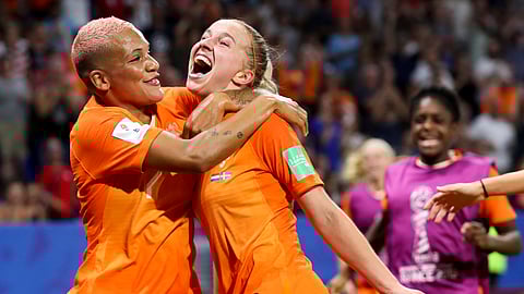 Netherlands’ Jackie Groenen, is congratulated by teammate Shanice Van De Sanden, left, after scoring during the Women’s World Cup semifinal soccer match between the Netherlands and Sweden, at the Stade de Lyon outside Lyon, France, Wednesday, July 3, 2019. (AP Photo/Francisco Seco)