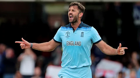 England's Liam Plunkett celebrates the dismissal of New Zealand's Henry Nicholls during the Cricket World Cup final match between England and New Zealand at Lord's cricket ground in London, England, Sunday, July 14, 2019. (AP Photo/Aijaz Rahi)