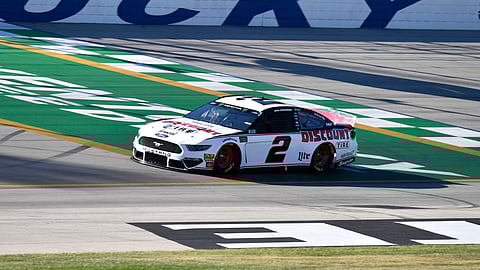 Brad Keselowski crosses the finish line during qualifying for a NASCAR Series auto race at Kentucky Speedway in Sparta, Ky., Friday, July 12, 2019. (AP Photo/Timothy D. Easley)