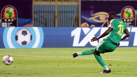 Senegal’s Sadio Mane scores from the penalty spot against Kenya on July 1 (Hassan Ammar)