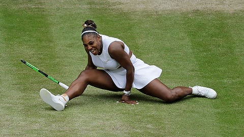 United States’ Serena Williams does the splits after playing a return to United States’ Alison Riske in a Women’s quarterfinal singles match on day eight of the Wimbledon Tennis Championships in London, Tuesday, July 9, 2019.