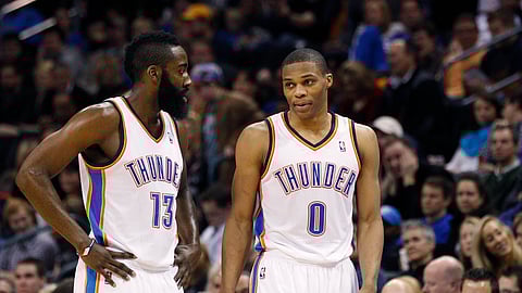 In this Jan. 25, 2012 photo Oklahoma City Thunder guard James Harden, left, talks with teammate Russell Westbrook in the fourth quarter of an NBA basketball game in Oklahoma City.
