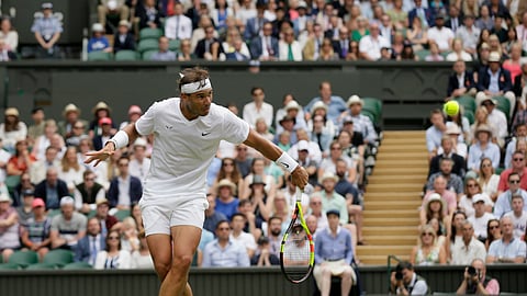 Spain’s Rafael Nadal returns to Jo-Wilfried Tsonga in a Men’s singles match during day six of the Wimbledon Tennis Championships in London, Saturday, July 6, 2019. (AP Photo/Tim Ireland)  