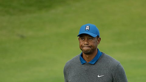 Tiger Woods of the United States looks up as he walks off the 18th green after completing his first round of the British Open Golf Championships at Royal Portrush in Northern Ireland, Thursday, July 18, 2019. (AP Photo/Matt Dunham)