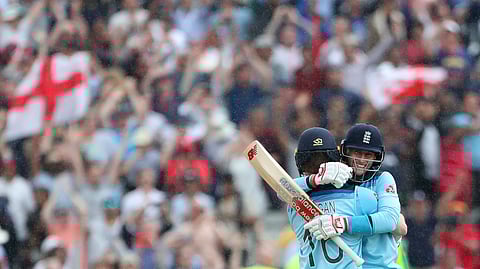 England's captain Eoin Morgan, left, hugs teammate Joe Root to celebrate their win over Australia in the Cricket World Cup semi-final match at Edgbaston in Birmingham, England, Thursday, July 11, 2019. (AP Photo/Aijaz Rahi)