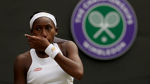 United States’ Cori “Coco” Gauff wipes her face during a women’s singles match against Romania’s Simona Halep on day seven of the Wimbledon Tennis Championships in London, Monday, July 8, 2019. 