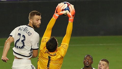 Union’s Kacper Przybylko (23) watches goalie Matt Freese make a save against Orlando City July (Stephen M. Dowell/Orlando Sentinel)