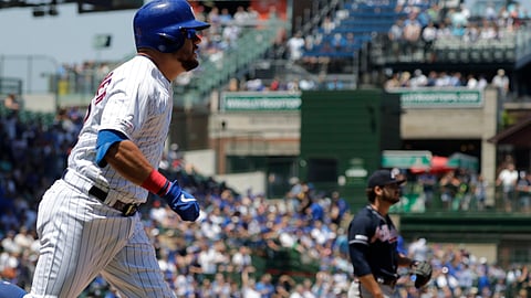 Braves’ Bryse Wilson (right) waits as Cubs’ Kyle Schwarber completes his home run trot on June 27 (Nam Y. Huh)