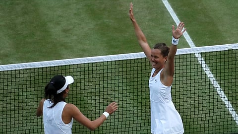 Czech Republic's Barbora Strycova, right, and Taiwan's Su-Wei Hsieh celebrate defeating Canada's Gabriela Dabrowski and China's Yifan Xu in the women's doubles final match of the Wimbledon Tennis Championships in London, Sunday, July 14, 2019. (AP Photo/Ben Curtis)