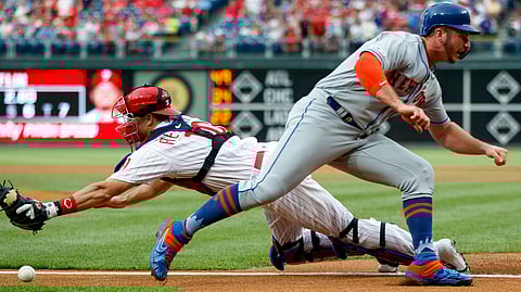Mets’ Pete Alonso eases past Phillies catcher J.T. Realmuto to score a first-inning run against Zach Eflin on June 24 (Matt Slocum)