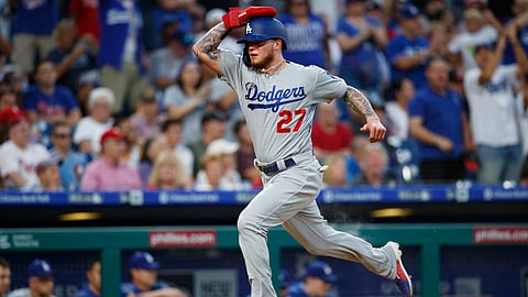 Los Angeles Dodgers' Alex Verdugo runs home to score on an RBI-double by Justin Turner during the fourth inning of a baseball game against the Philadelphia Phillies, Monday, July 15, 2019, in Philadelphia. (AP Photo/Matt Slocum)