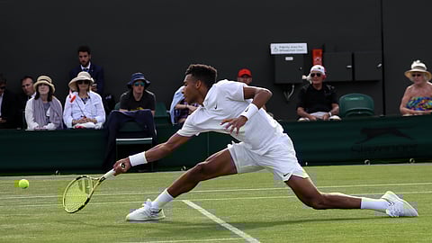 Canada’s Felix Auger-Aliassime returns to Corentin Moutet of France in a Men’s singles match during day three of the Wimbledon Tennis Championships in London, Wednesday, July 3, 2019. (AP Photo/Kirsty Wigglesworth)